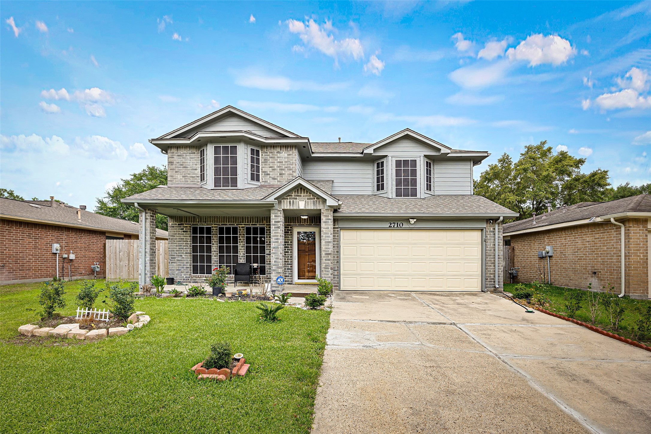 2710 Fox View Circle Spring, TX 77386 - Photo 1 of 29 a front view of a house with a yard and garage