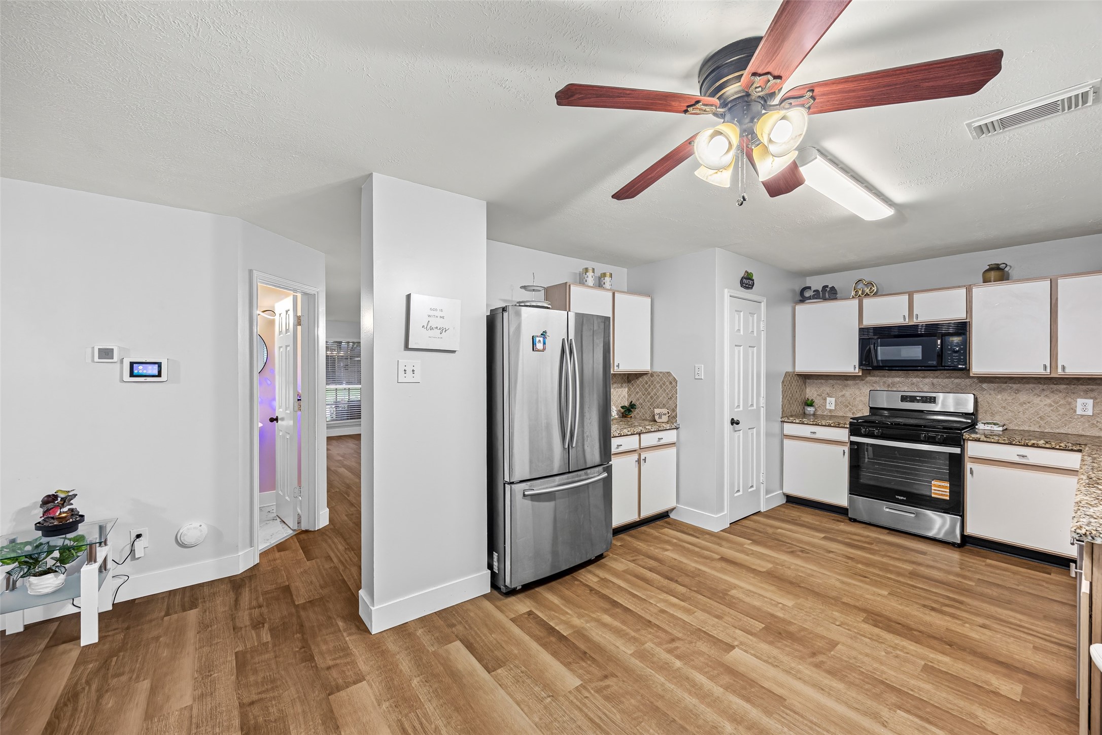 2710 Fox View Circle Spring, TX 77386 - Photo 14 of 29 a kitchen with stainless steel appliances granite countertop a refrigerator and a stove top oven