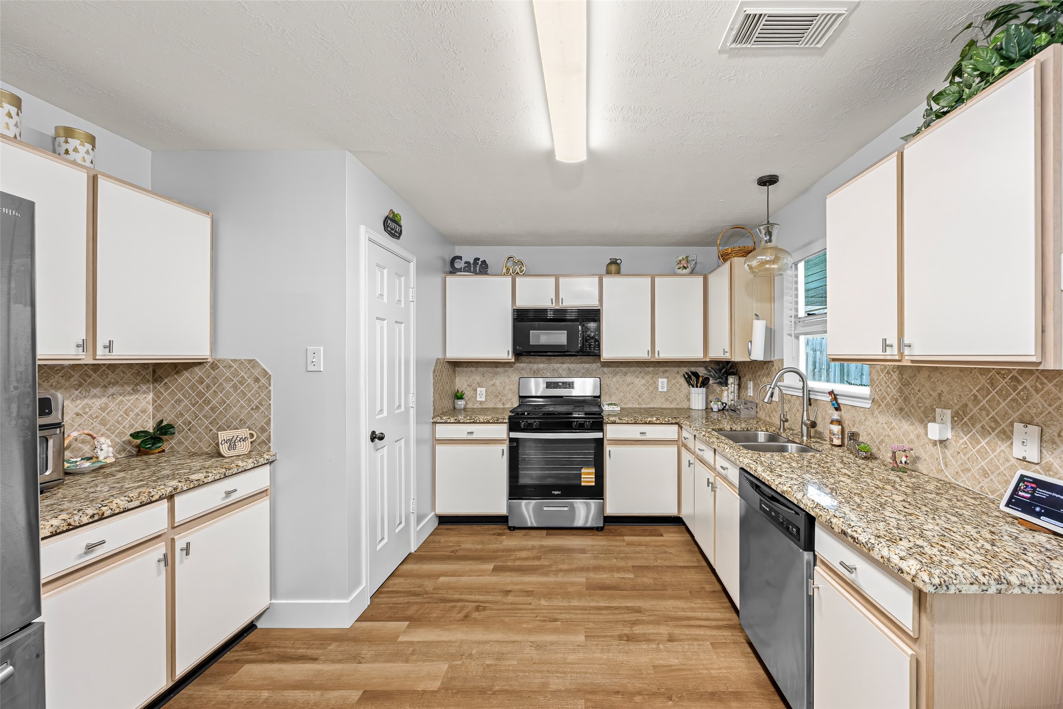 2710 Fox View Circle Spring, TX 77386 - Photo 16 of 29 a kitchen with a sink stove top oven and refrigerator