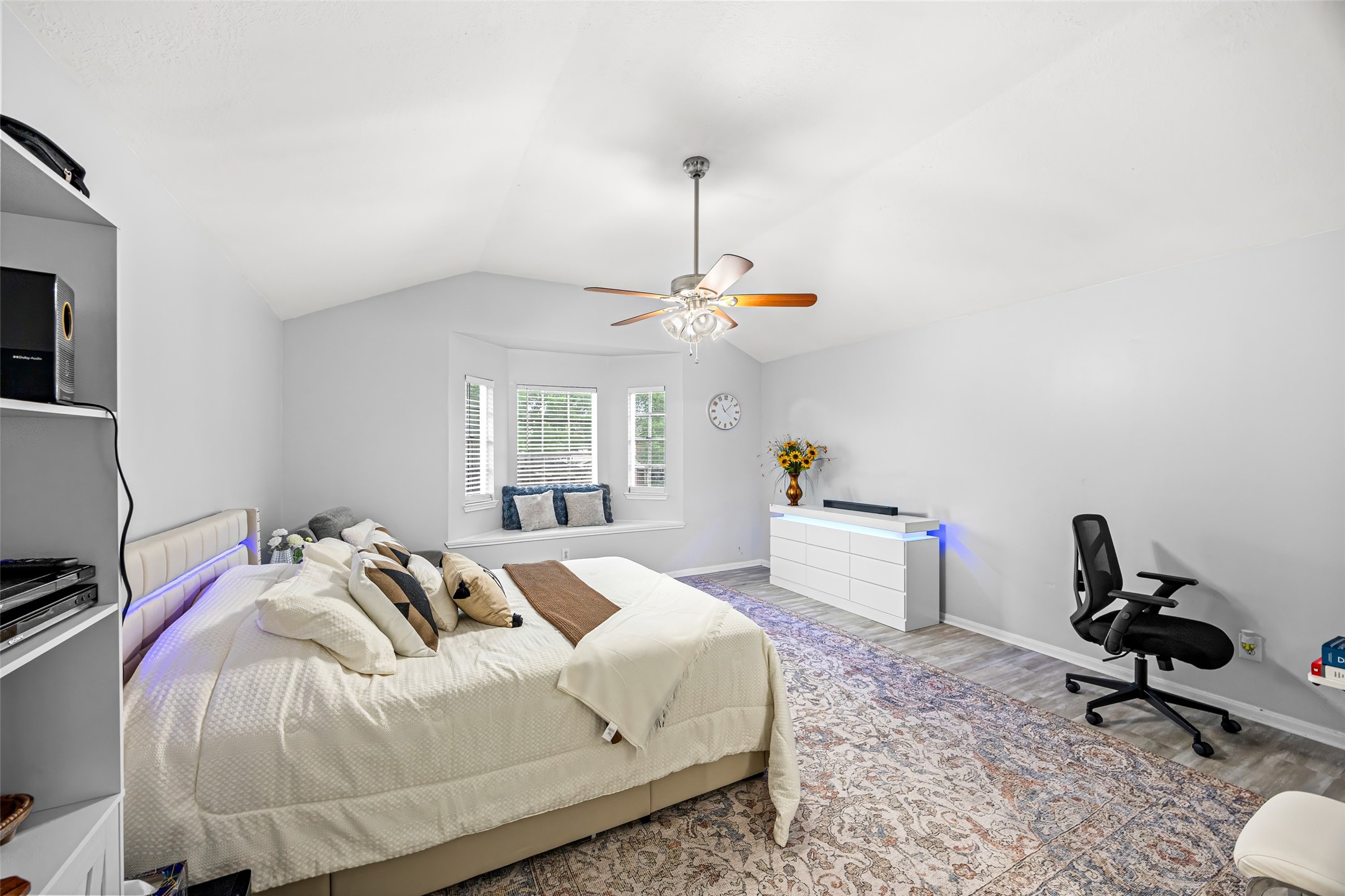 2710 Fox View Circle Spring, TX 77386 - Photo 19 of 29 a bedroom with a bed and a chandelier