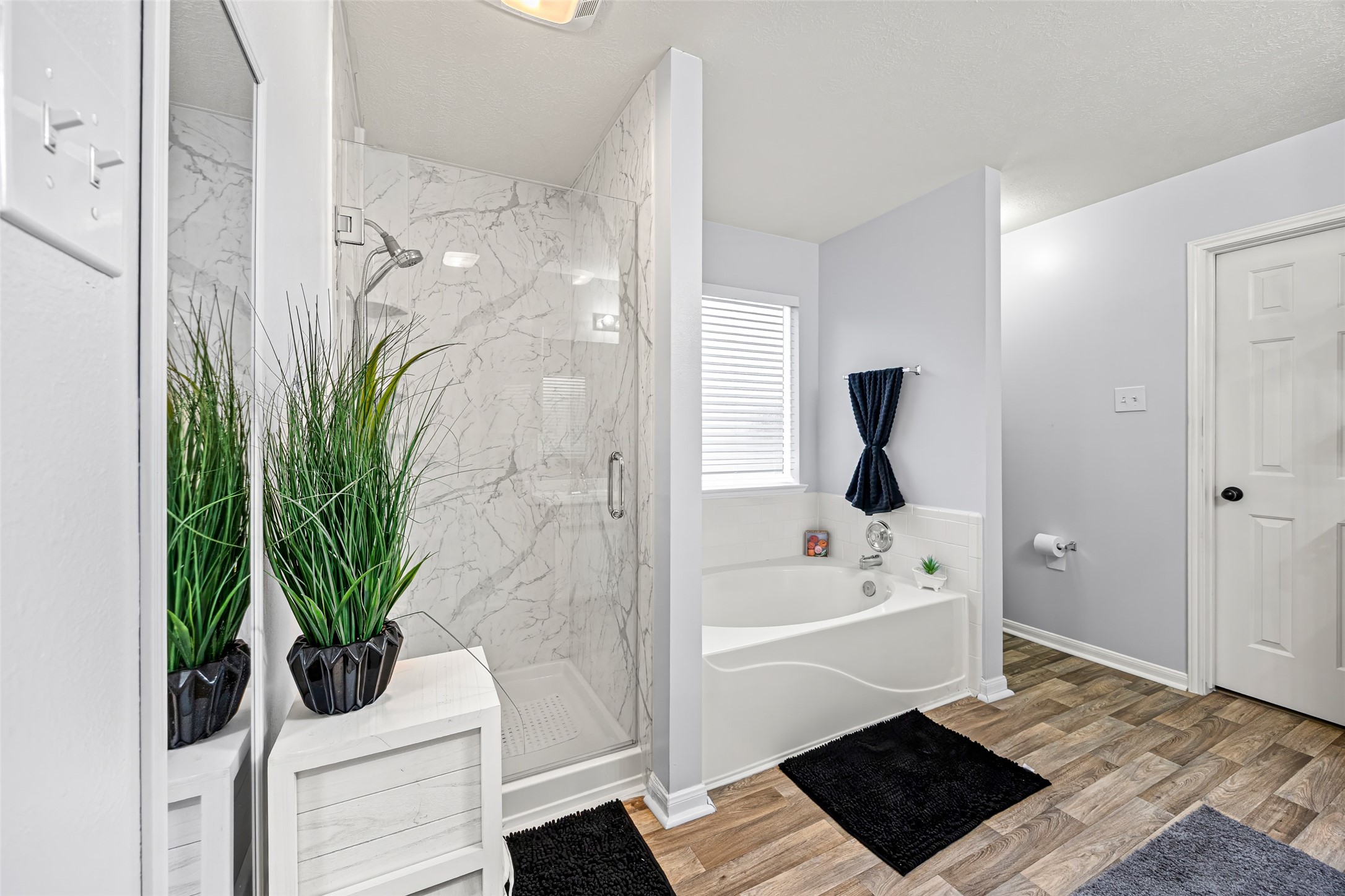 2710 Fox View Circle Spring, TX 77386 - Photo 21 of 29 a bathroom with a bathtub a sink a toilet a rug and shower