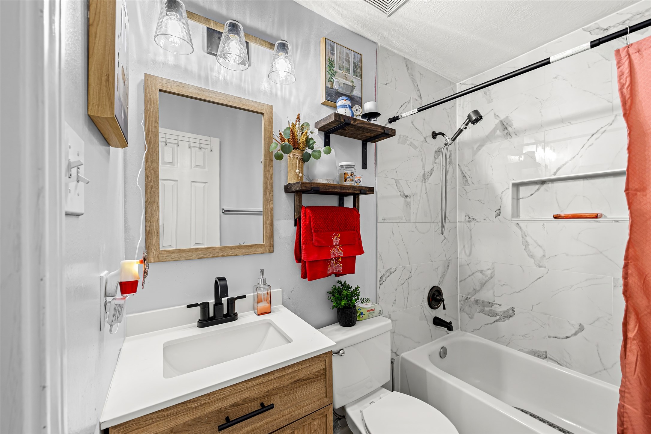 2710 Fox View Circle Spring, TX 77386 - Photo 23 of 29 a bathroom with a sink vanity mirror bathtub shower and toilet