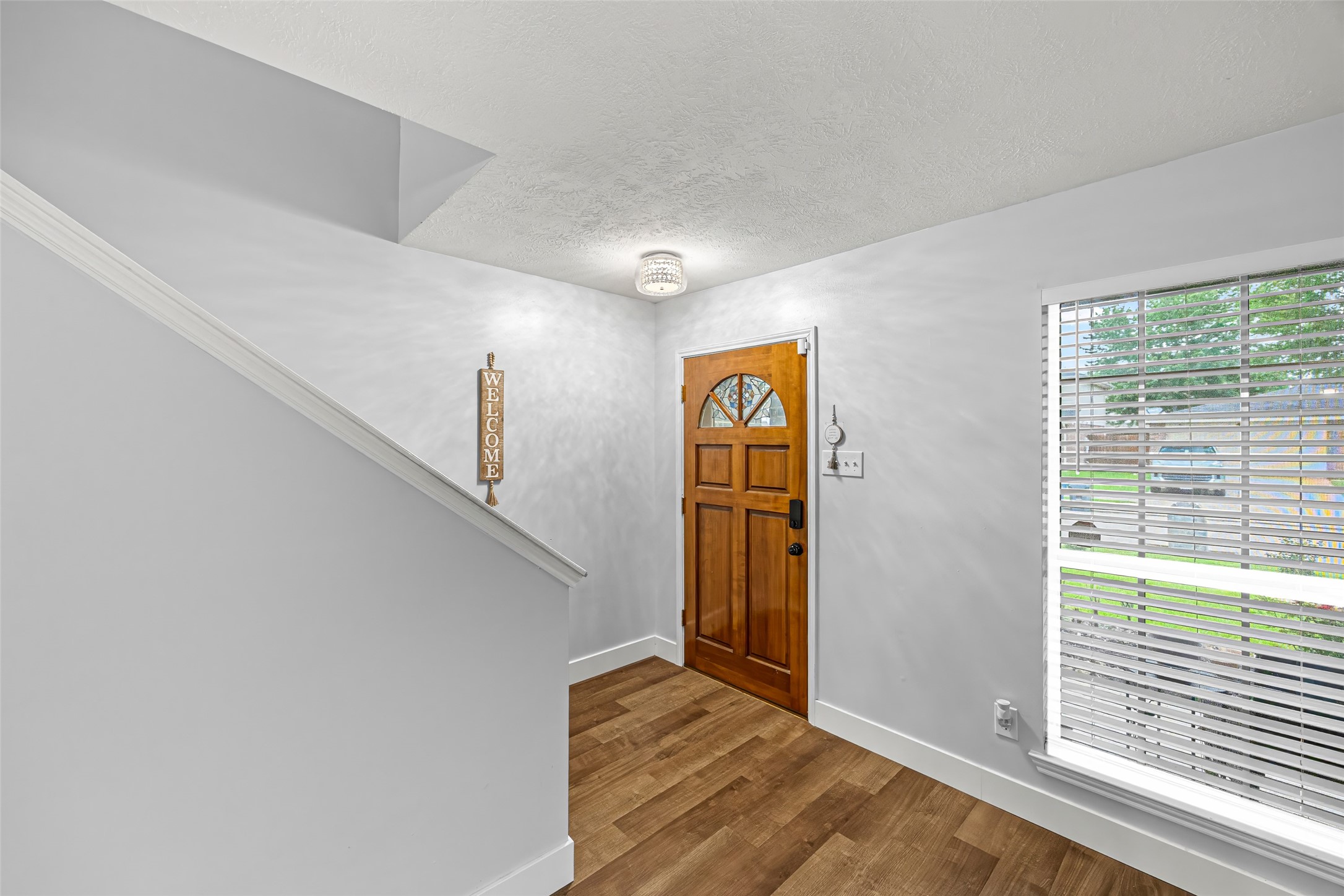 2710 Fox View Circle Spring, TX 77386 - Photo 5 of 29 a view of entryway and hall with wooden floor