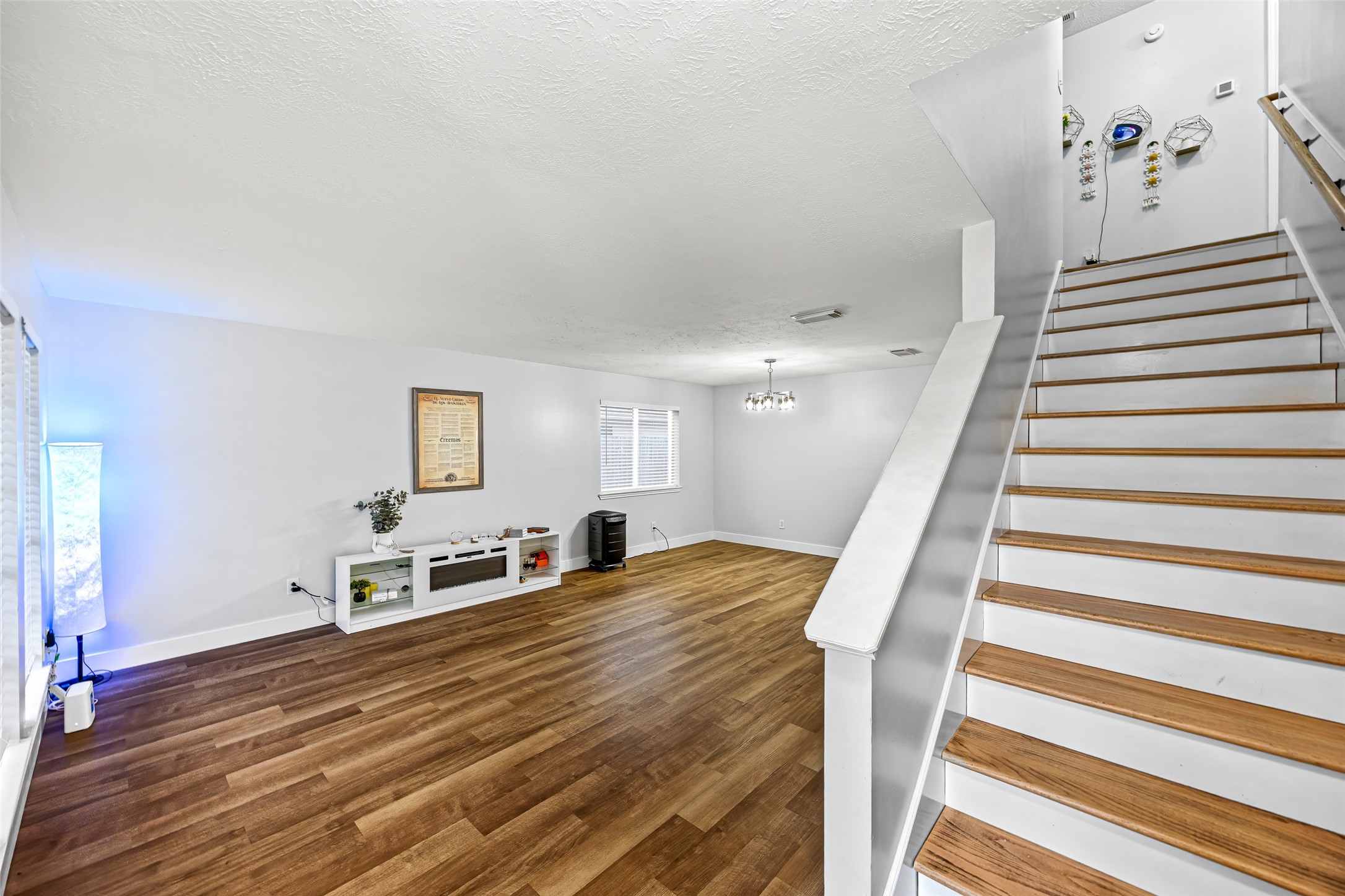 2710 Fox View Circle Spring, TX 77386 - Photo 6 of 29 a view of a bedroom with wooden floor and stairs