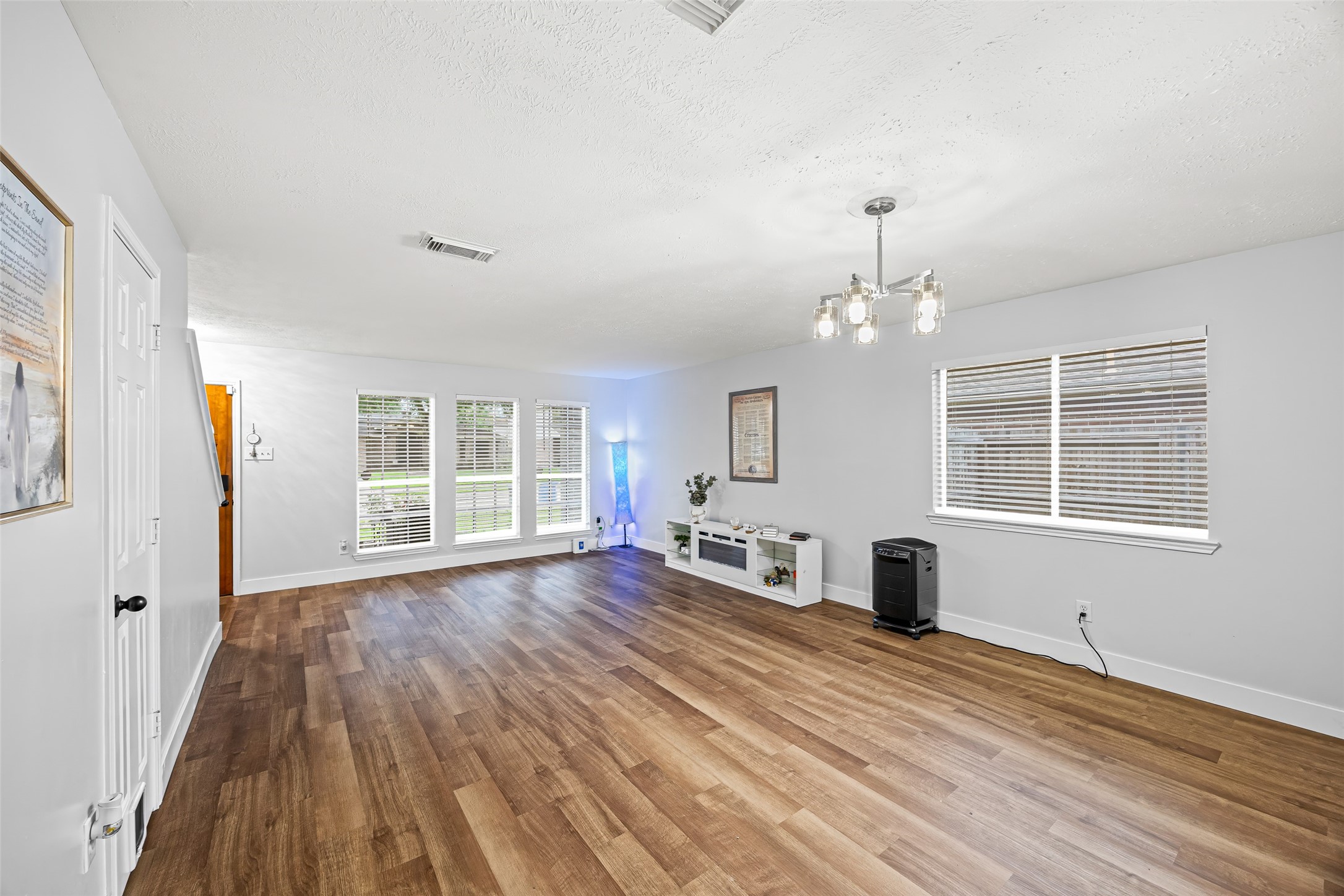 2710 Fox View Circle Spring, TX 77386 - Photo 7 of 29 an empty room with wooden floor and windows