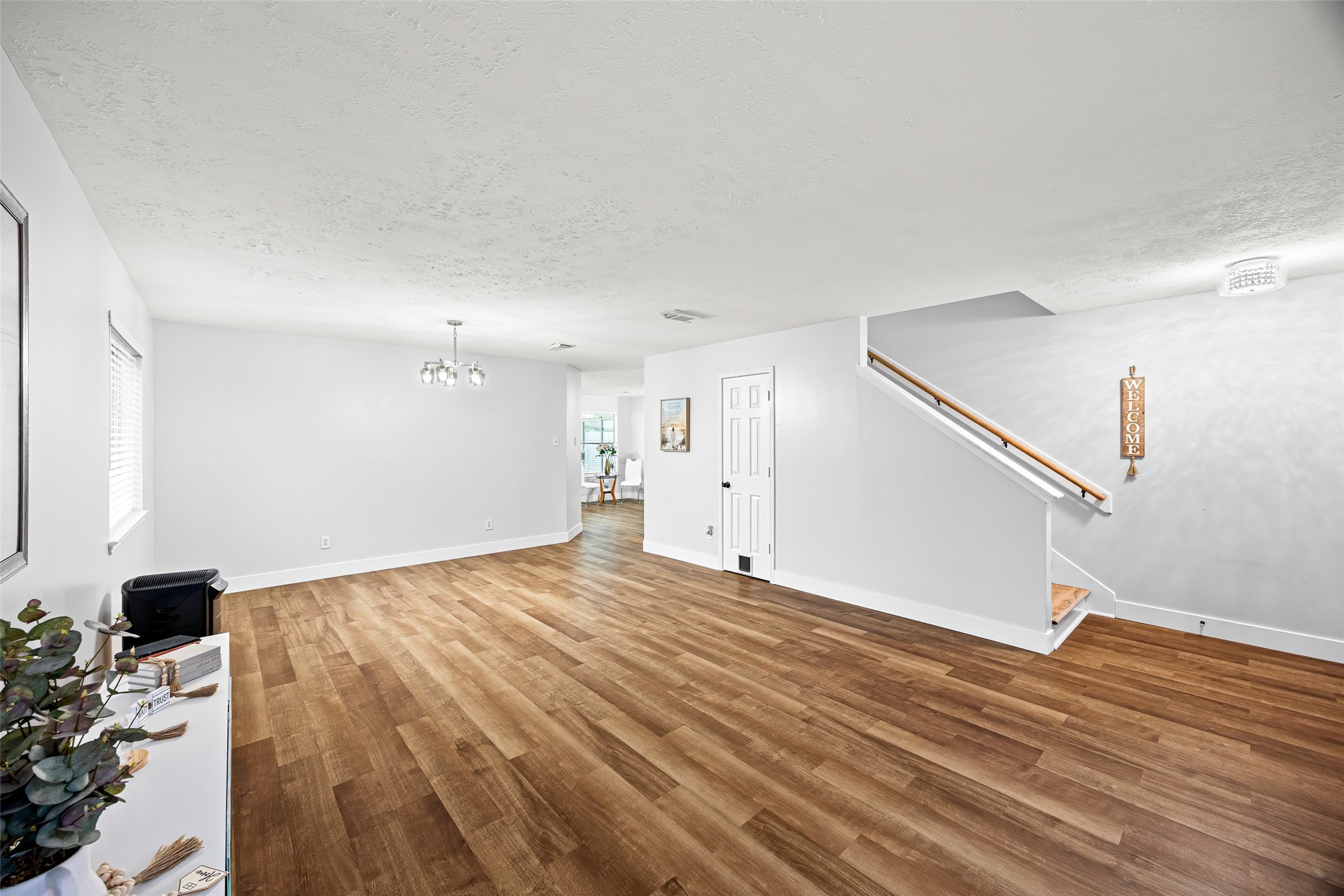 2710 Fox View Circle Spring, TX 77386 - Photo 8 of 29 a view of a livingroom with wooden floor and staircase