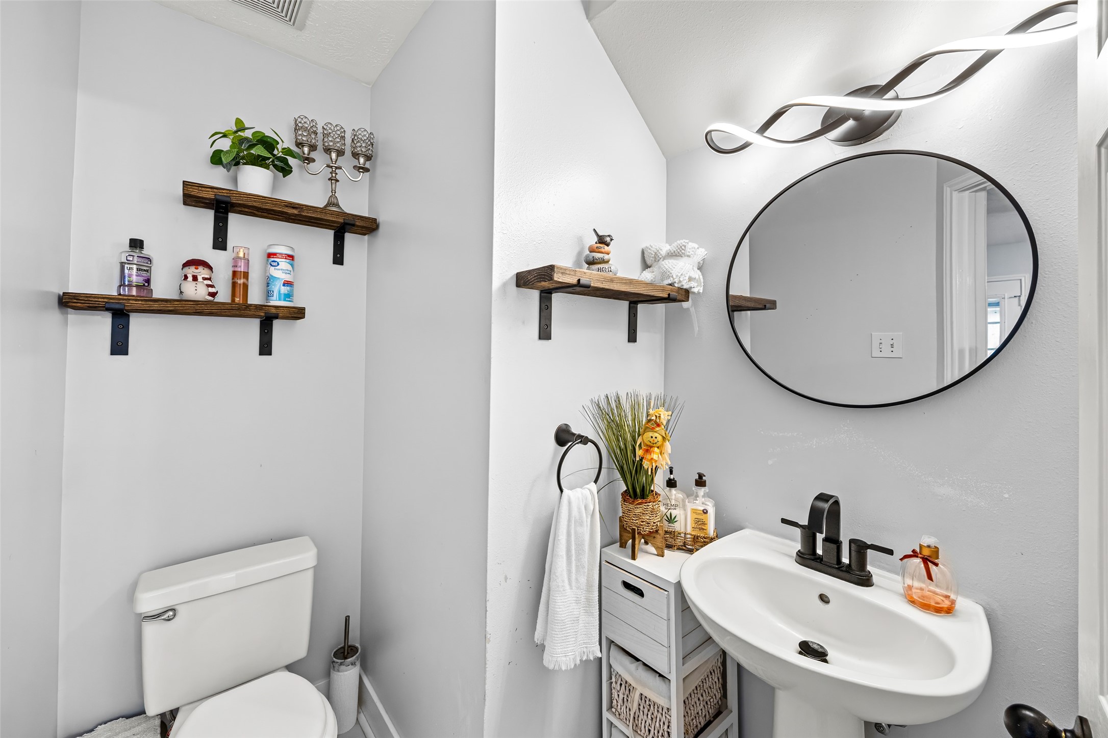 2710 Fox View Circle Spring, TX 77386 - Photo 9 of 29 a bathroom with a sink mirror and toilet