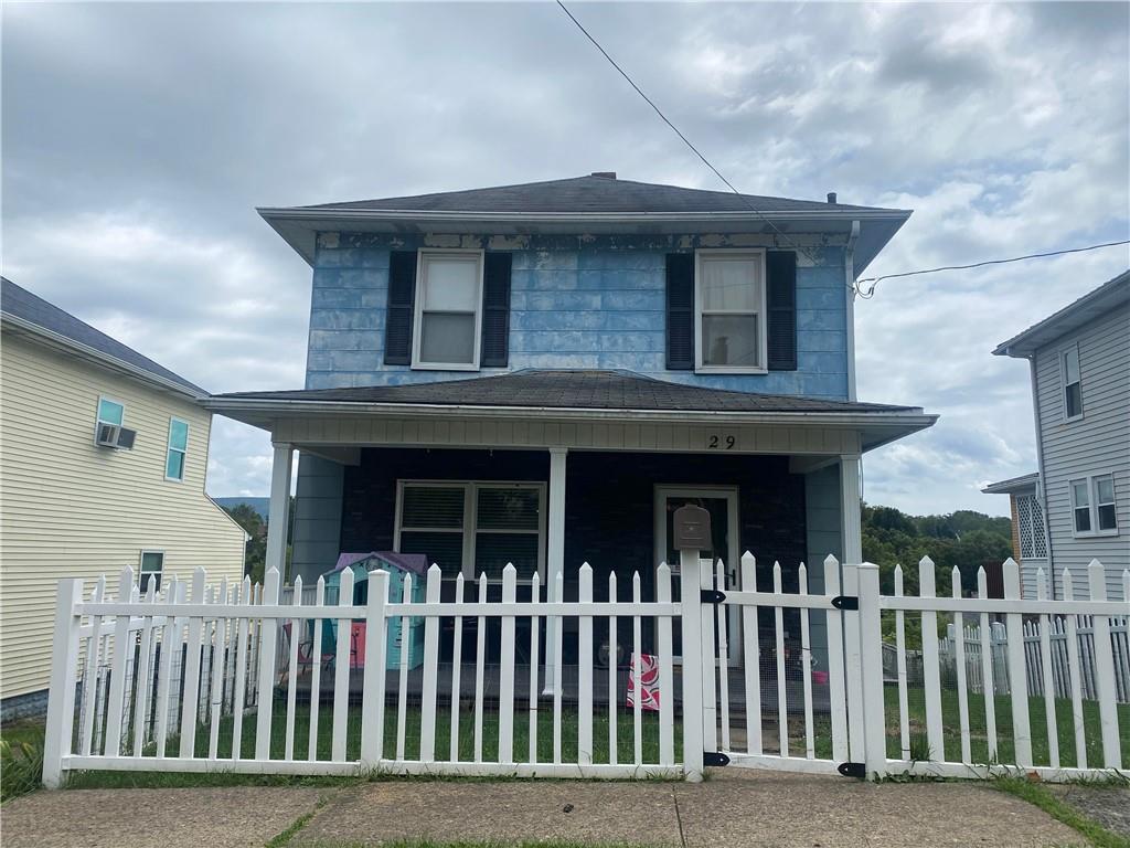 a front view of a house with a porch