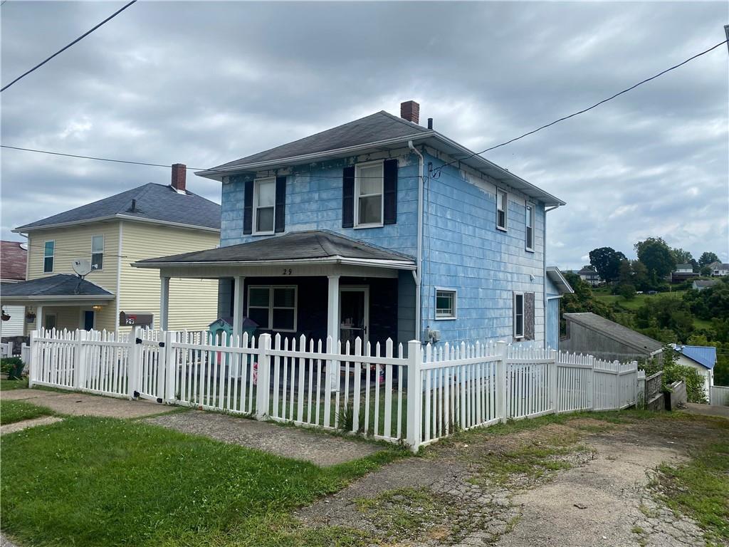 29 Vernon Street Uniontown, PA 15401 - Photo 2 of 3 a front view of a house with a yard