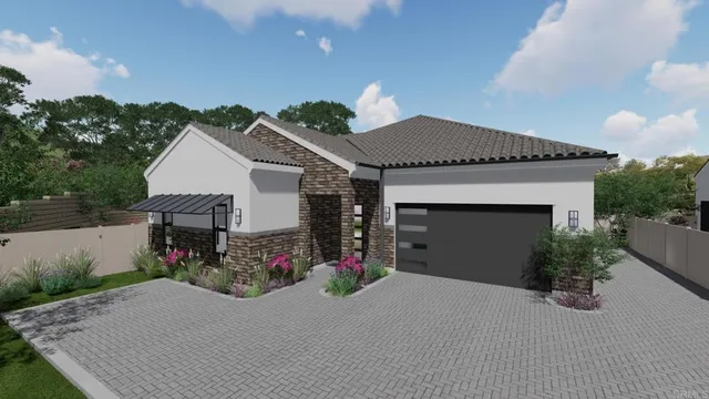 a front view of a house with a yard and a garage