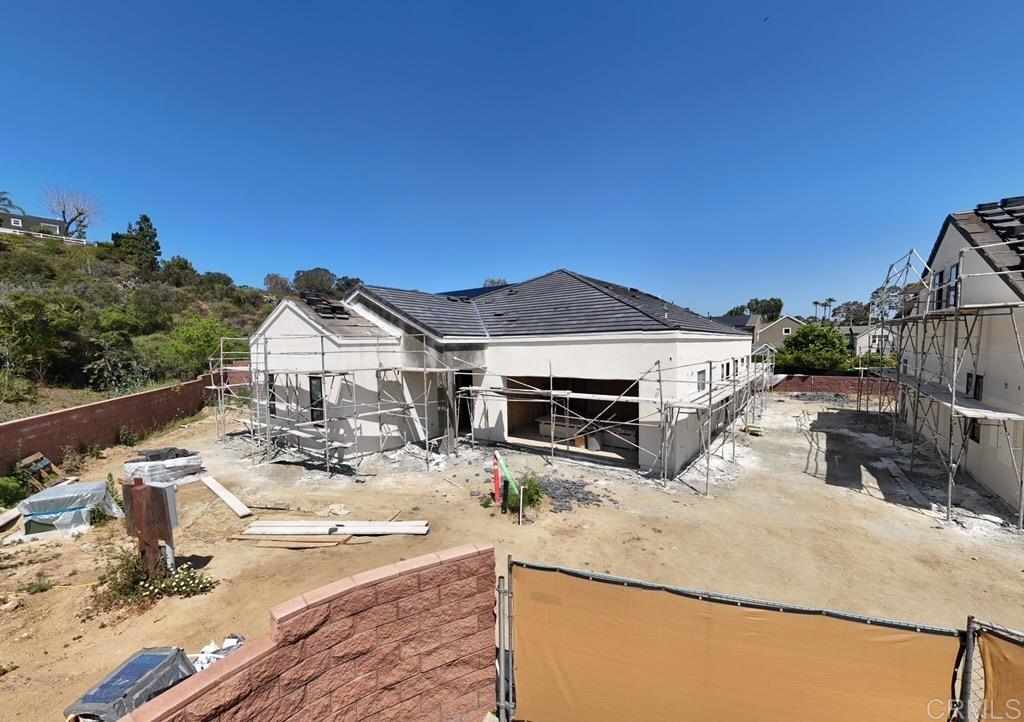 1331 Berryman Canyon Encinitas, CA 92024 - Photo 9 of 9 a view of a house with wooden fence