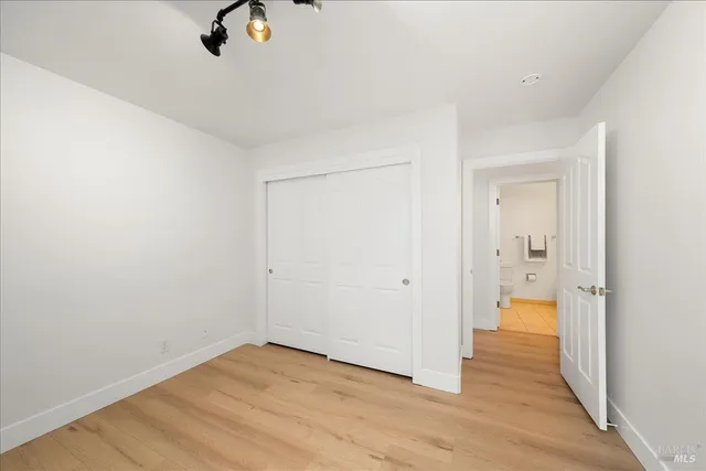 a bath tub sitting in front of a bathroom next to a window