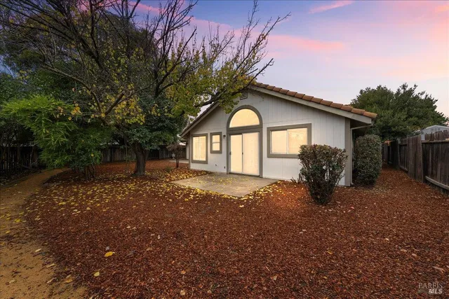 a front view of house with small garden