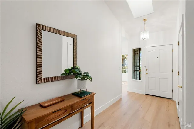 a workspace with furniture window and wooden floor