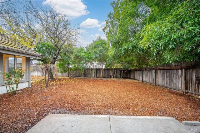 a backyard of a house with lots of green space