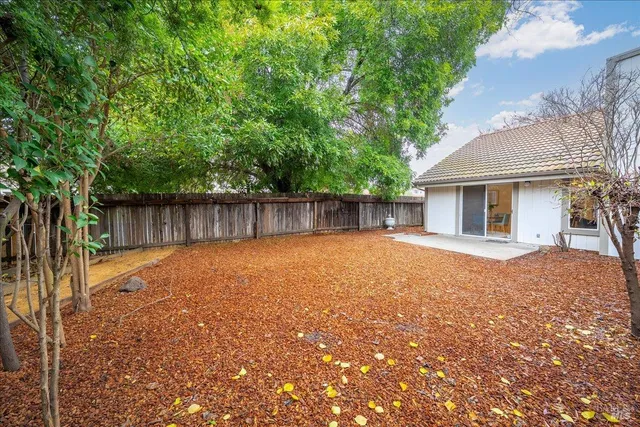 a front view of house with yard and trees