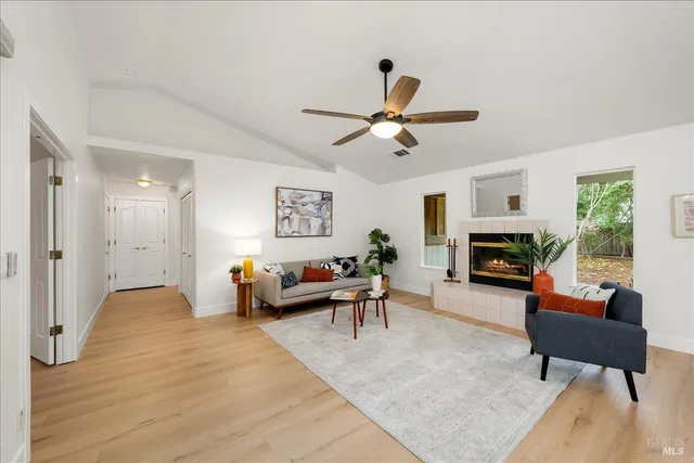 a spacious bedroom with a bed and a large window