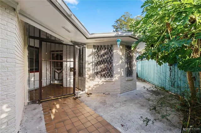 a view of a porch with furniture and wooden fence