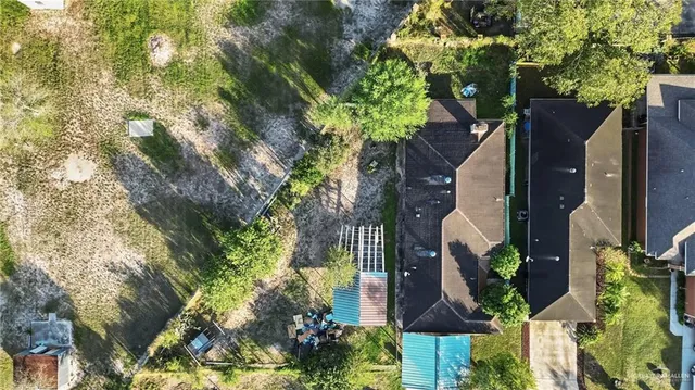 an aerial view of house with yard