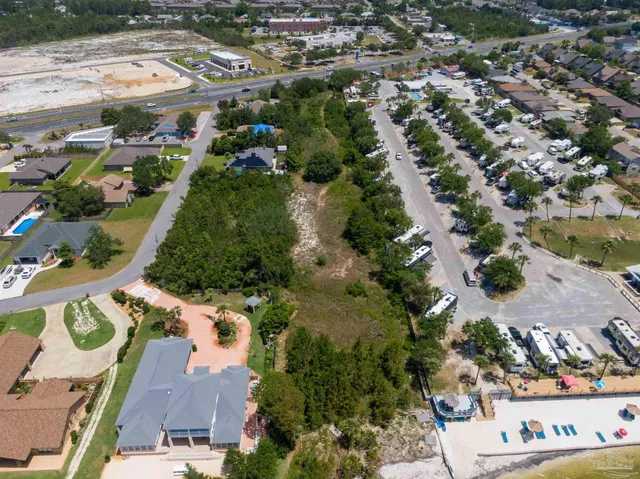 an aerial view of residential houses with outdoor space