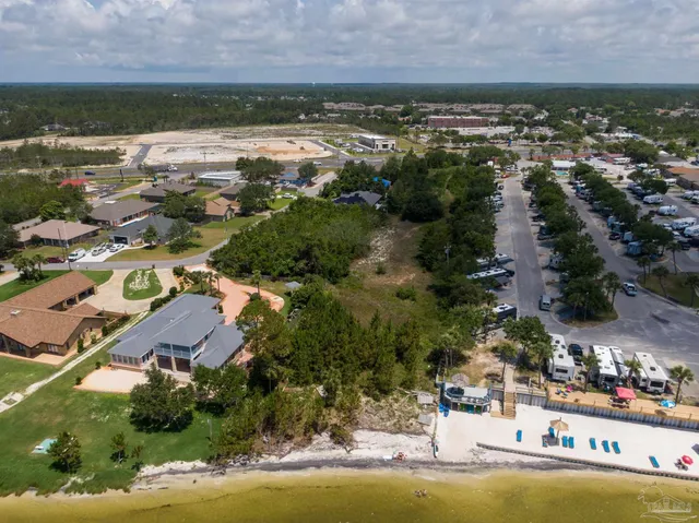 an aerial view of residential building and lake