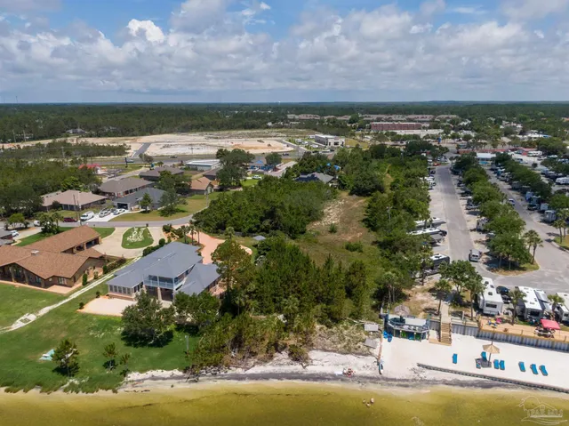 an aerial view of residential building and lake