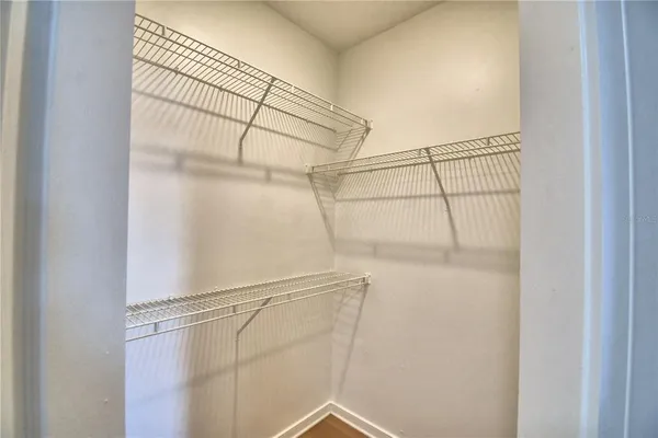 a bathroom with a double vanity sink mirror and toilet