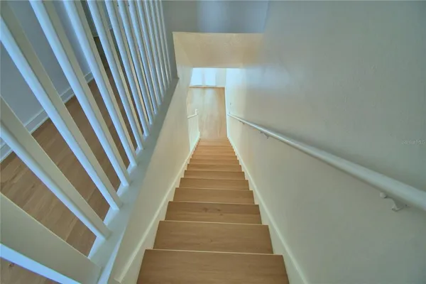 a view of bathroom with a sink and mirror