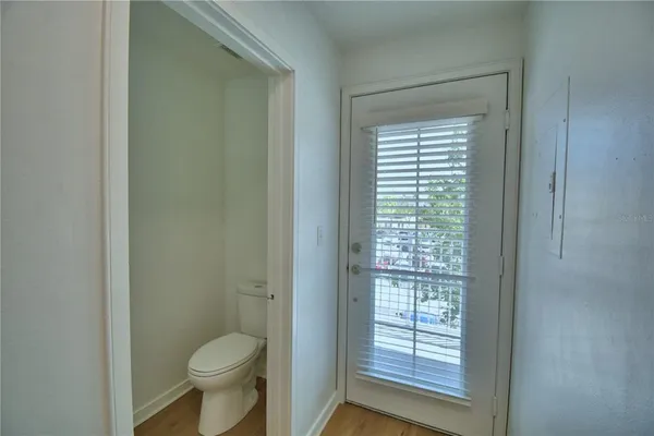 a view of hallway with wooden floor