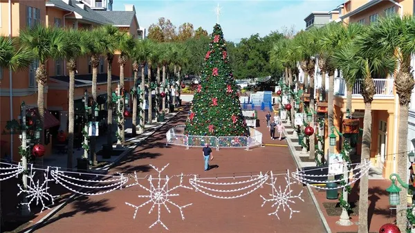 a view of a balcony with chairs and a potted plant