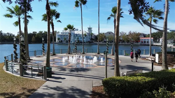 a view of a lake with a residential building in the background
