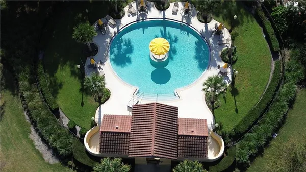an aerial view of a house with a yard