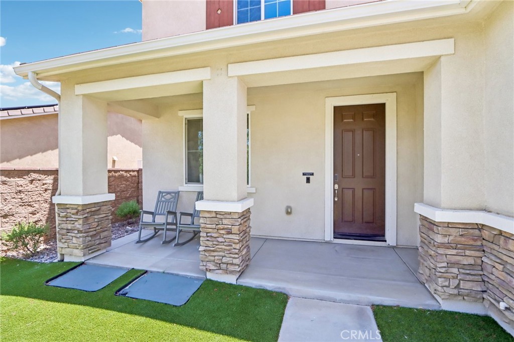 11056 Guffey Ranch Way Corona, CA 92883 - Photo 3 of 61 a view of an entryway with a table and chairs