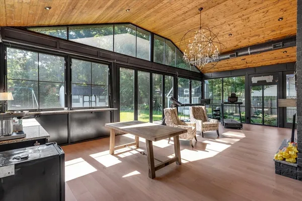 a kitchen with stainless steel appliances granite countertop sink stove and large window