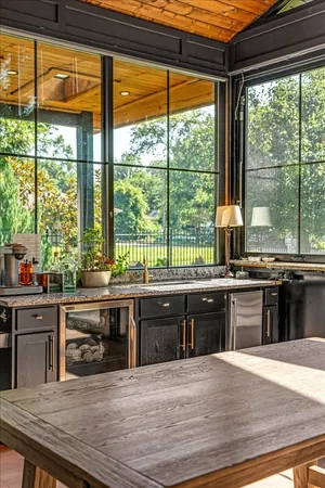 a kitchen with stainless steel appliances kitchen island granite countertop a sink and cabinets