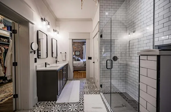 a bathroom with a bathtub and shower