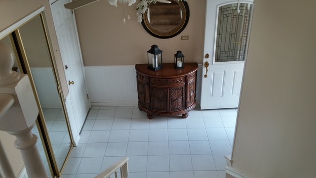 21W162 Coronet Road Lombard, IL 60148 - Photo 2 of 15 a bathroom with a sink a mirror and vanity