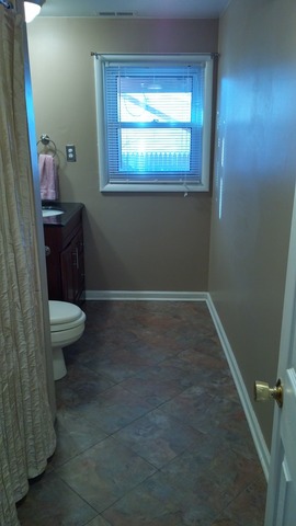 21W162 Coronet Road Lombard, IL 60148 - Photo 13 of 15 a bathroom with a toilet and a sink