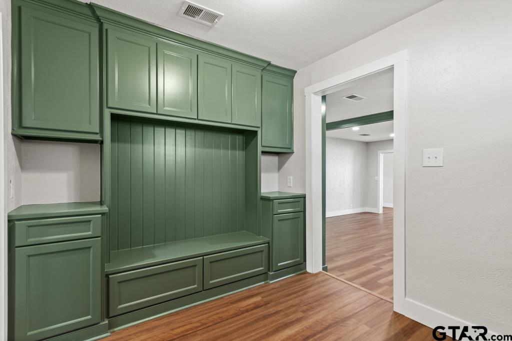 2819 New Copeland Road Tyler, TX 75701 - Photo 6 of 39 a view of empty room with wooden floor and cabinets