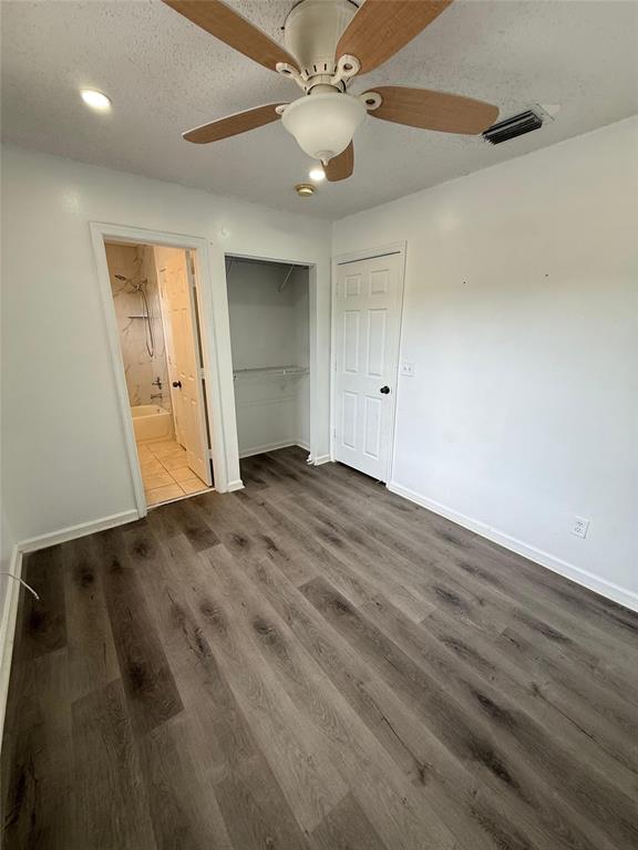 4243 Northwest 68 Way, Unit 4243 Fort Lauderdale, FL 33319 - Photo 14 of 15 an empty room with wooden floor and fan