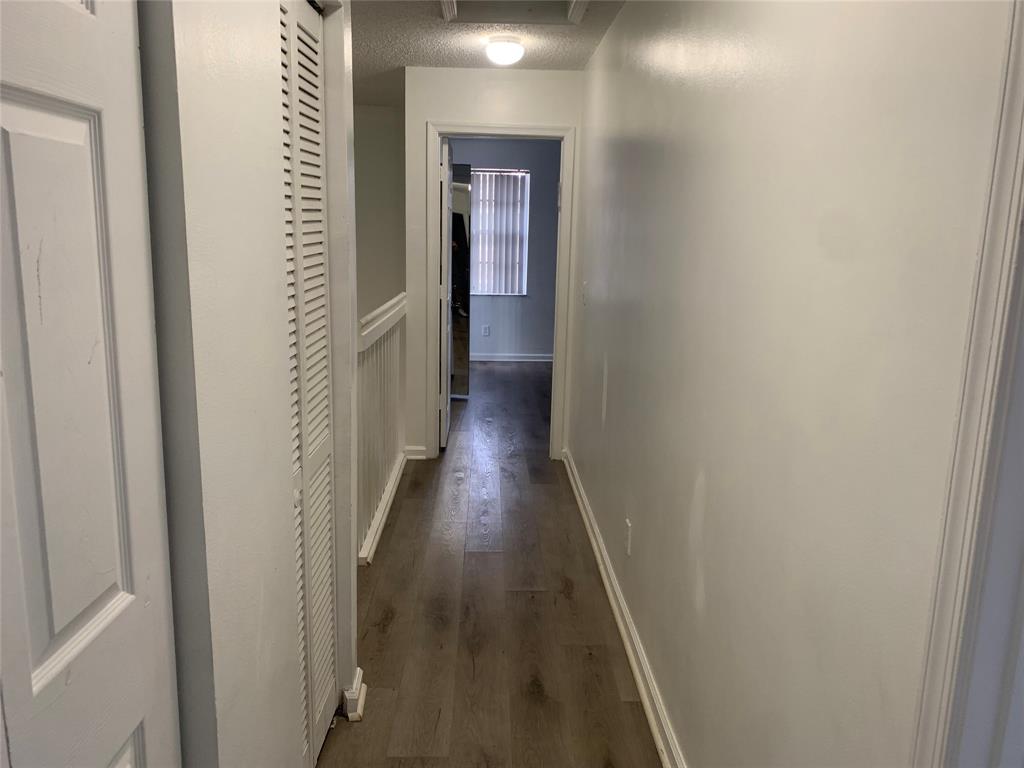 4243 Northwest 68 Way, Unit 4243 Fort Lauderdale, FL 33319 - Photo 4 of 15 a view of a hallway with wooden floor