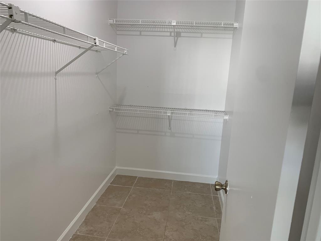 4243 Northwest 68 Way, Unit 4243 Fort Lauderdale, FL 33319 - Photo 6 of 15 a view of a room with racks on the wall