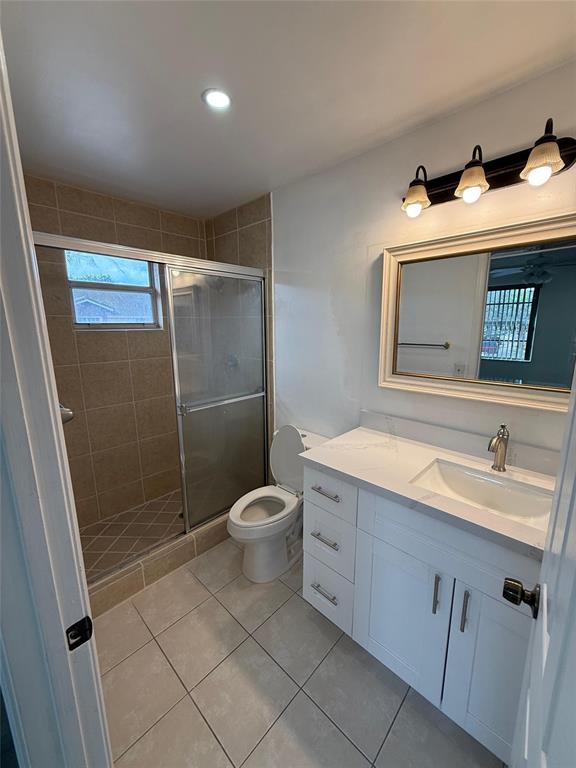4243 Northwest 68 Way, Unit 4243 Fort Lauderdale, FL 33319 - Photo 9 of 15 a bathroom with a sink a toilet and shower