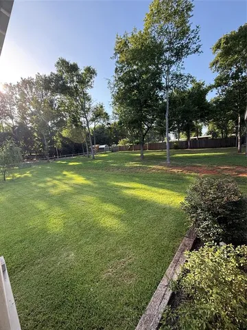 a view of a golf course with a lake