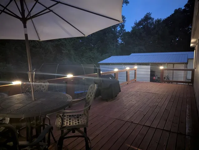 a patio with table and chairs