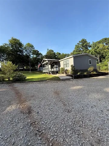 a view of swimming pool in front of residential houses