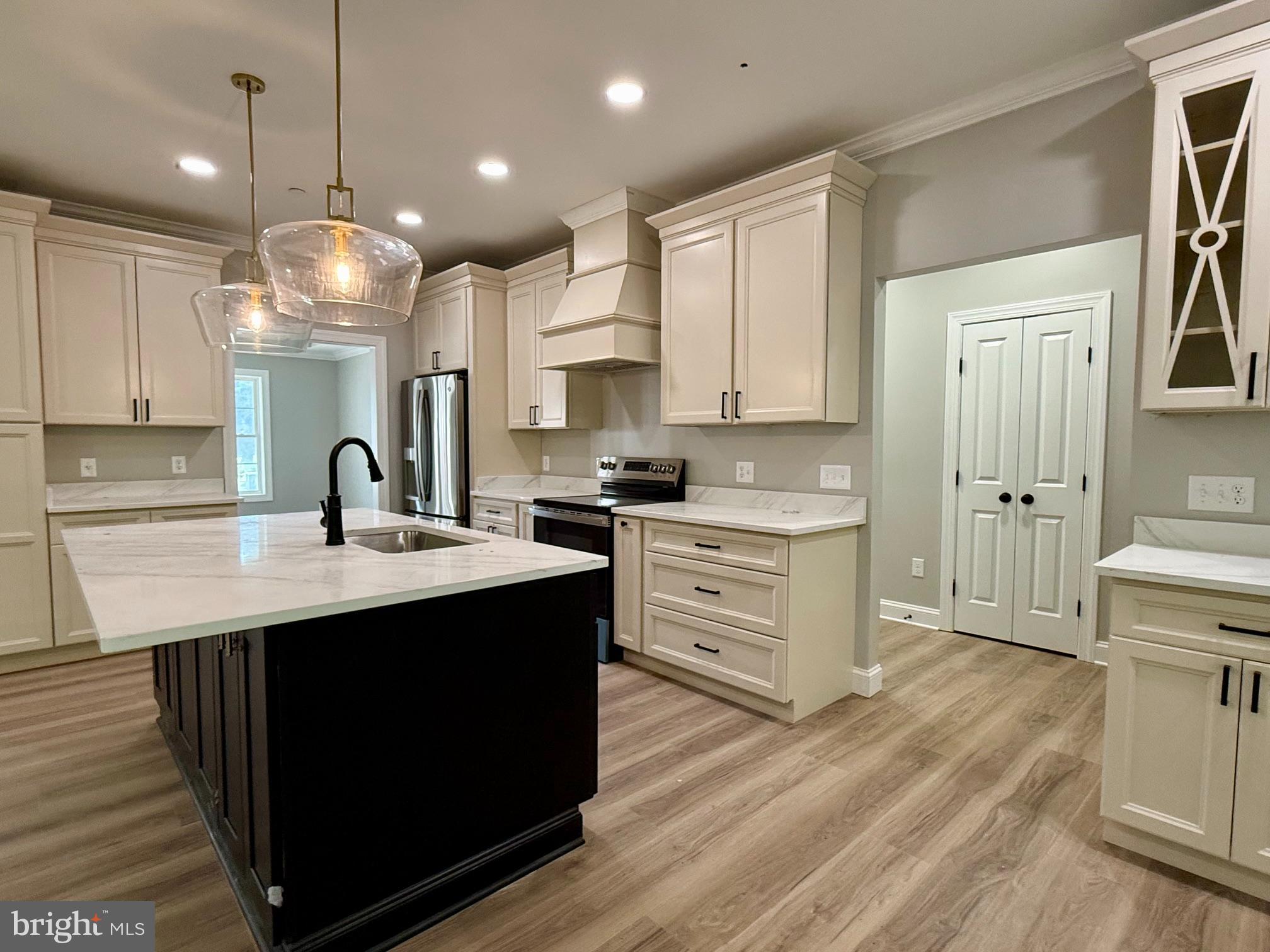 17480 Lighthouse Commons Drive Piney Point, MD 20674 - Photo 6 of 23 a kitchen with a sink stove and cabinets