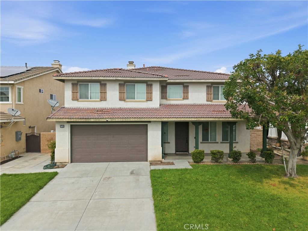 6710 Black Hawk Road Eastvale, CA 92880 - Photo 1 of 49 a front view of a house with a yard