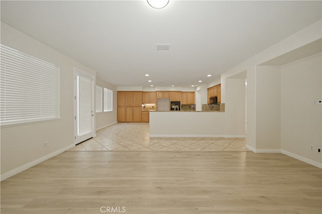 6710 Black Hawk Road Eastvale, CA 92880 - Photo 16 of 49 a view of a kitchen with a sink and a refrigerator