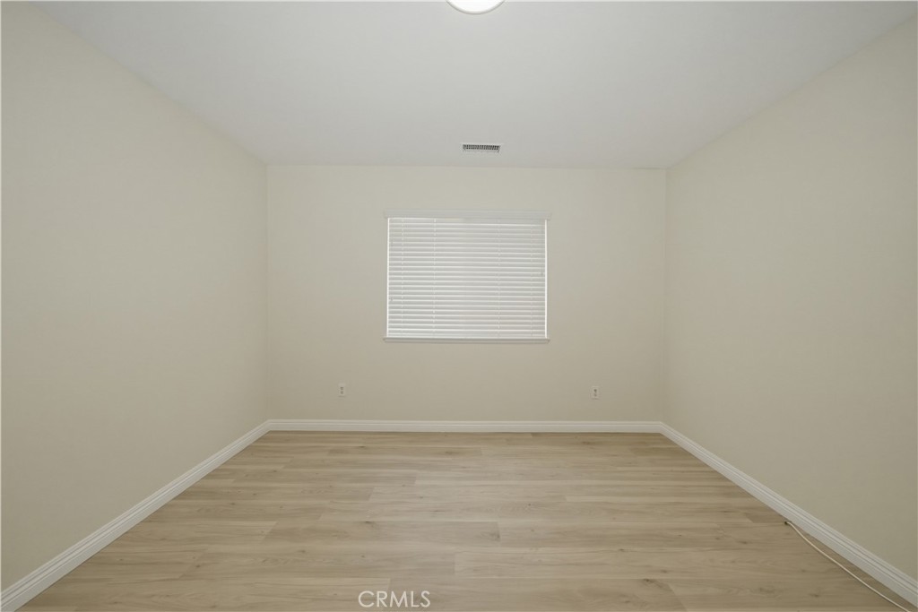 6710 Black Hawk Road Eastvale, CA 92880 - Photo 33 of 49 wooden floor in an empty room